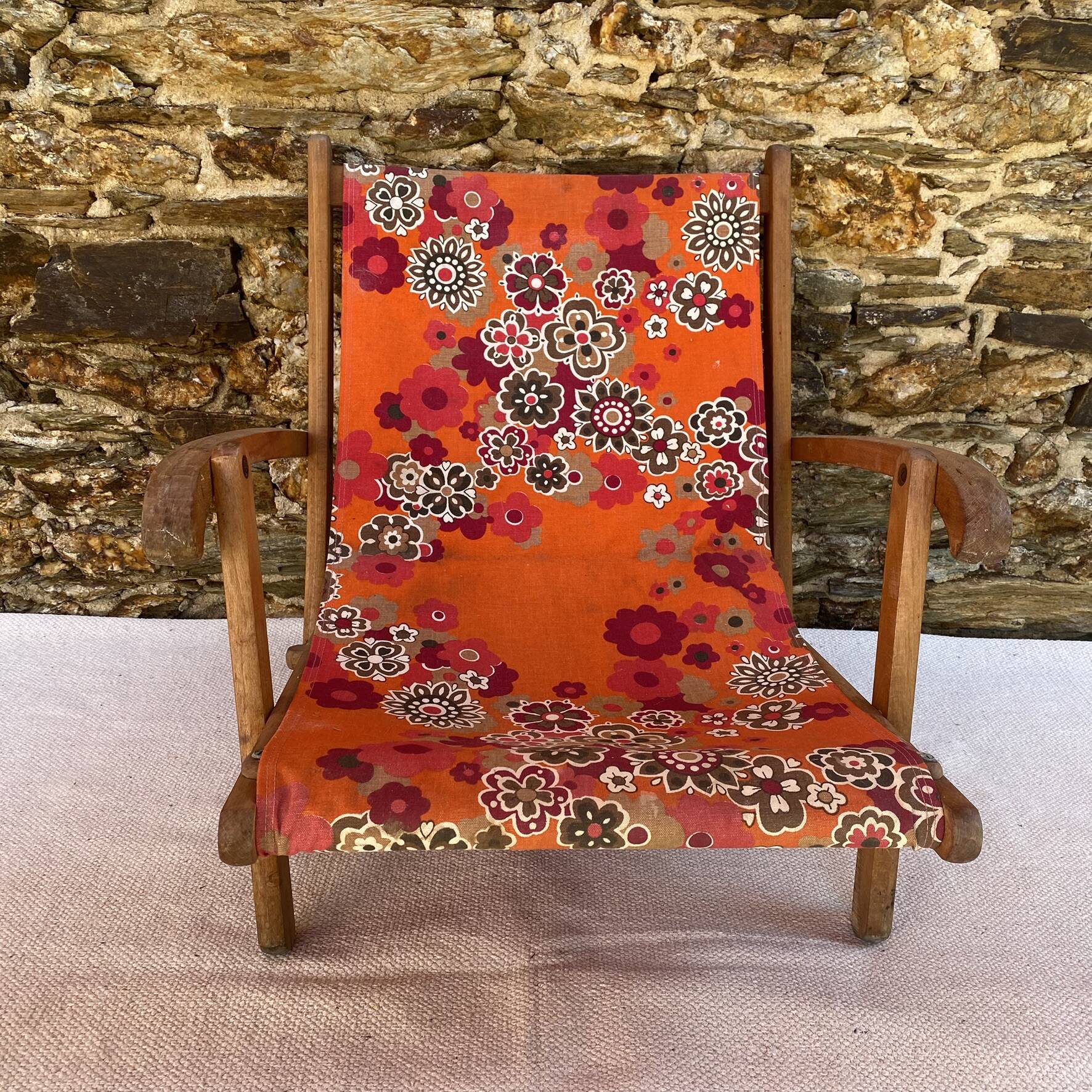 Vintage beach or garden chair made of wood and floral fabric, 1970s.