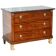 19th-century Empire commode with a marble top and lion paw feet.