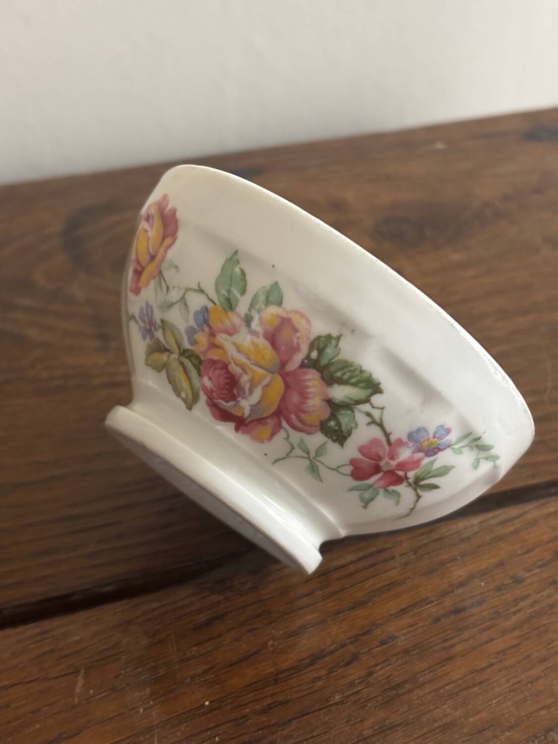 Vintage small antique bowl with floral decoration.