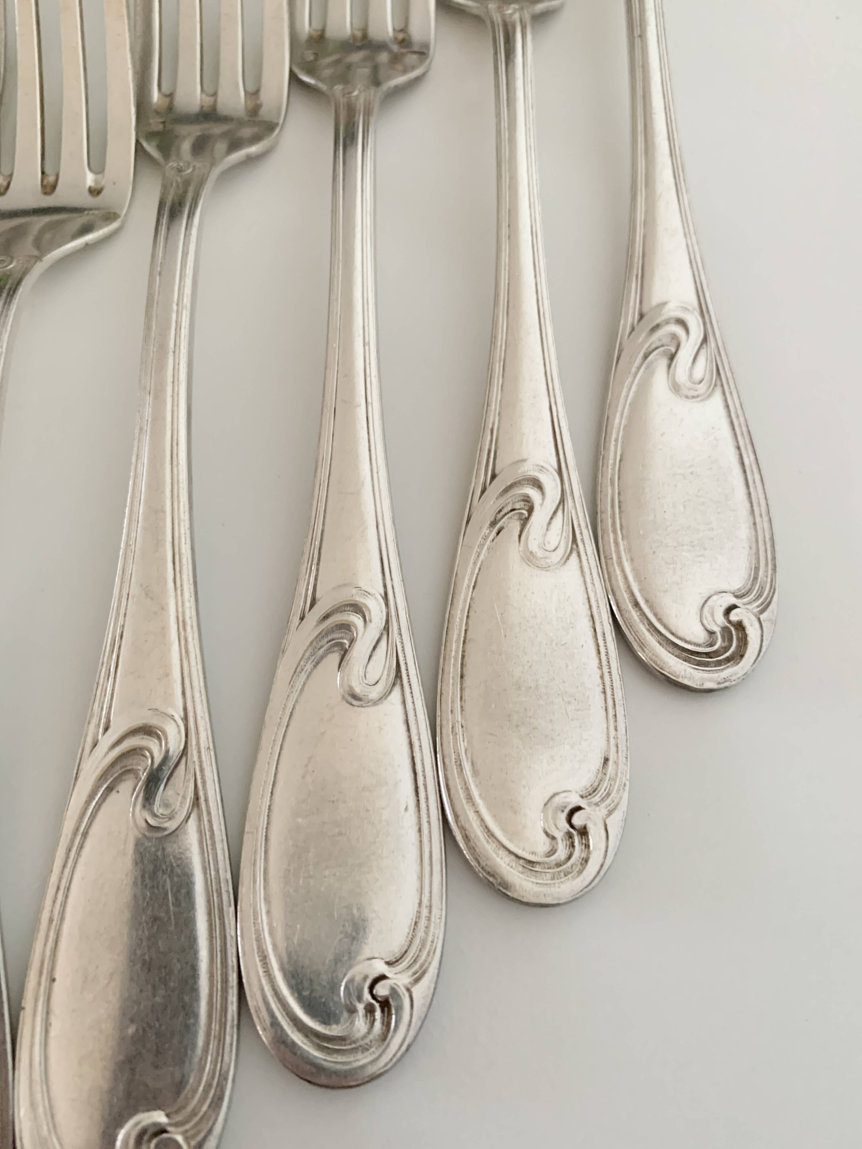 Nine large Ercuis silver-plated forks