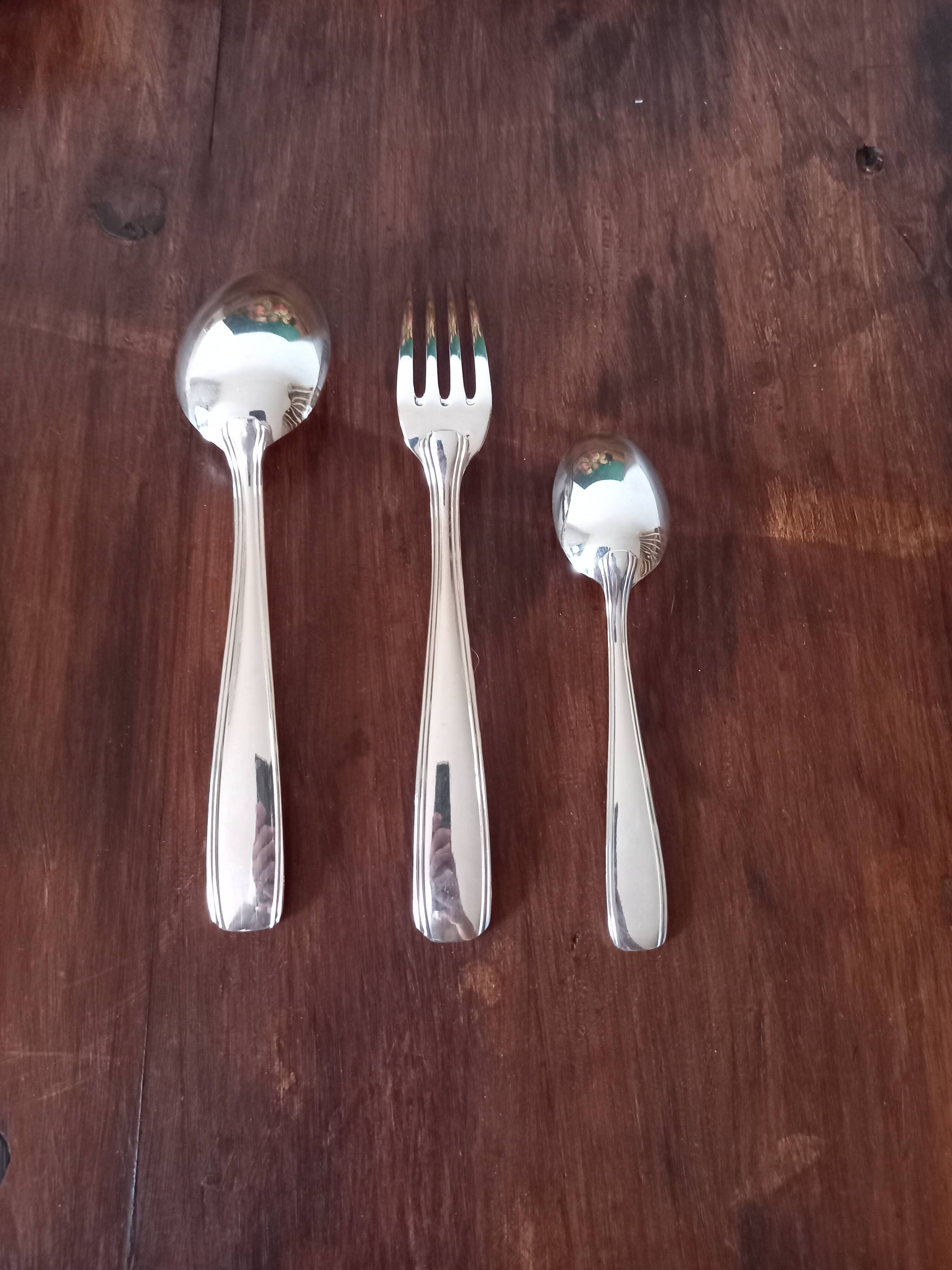 Trio of silver metal cutlery