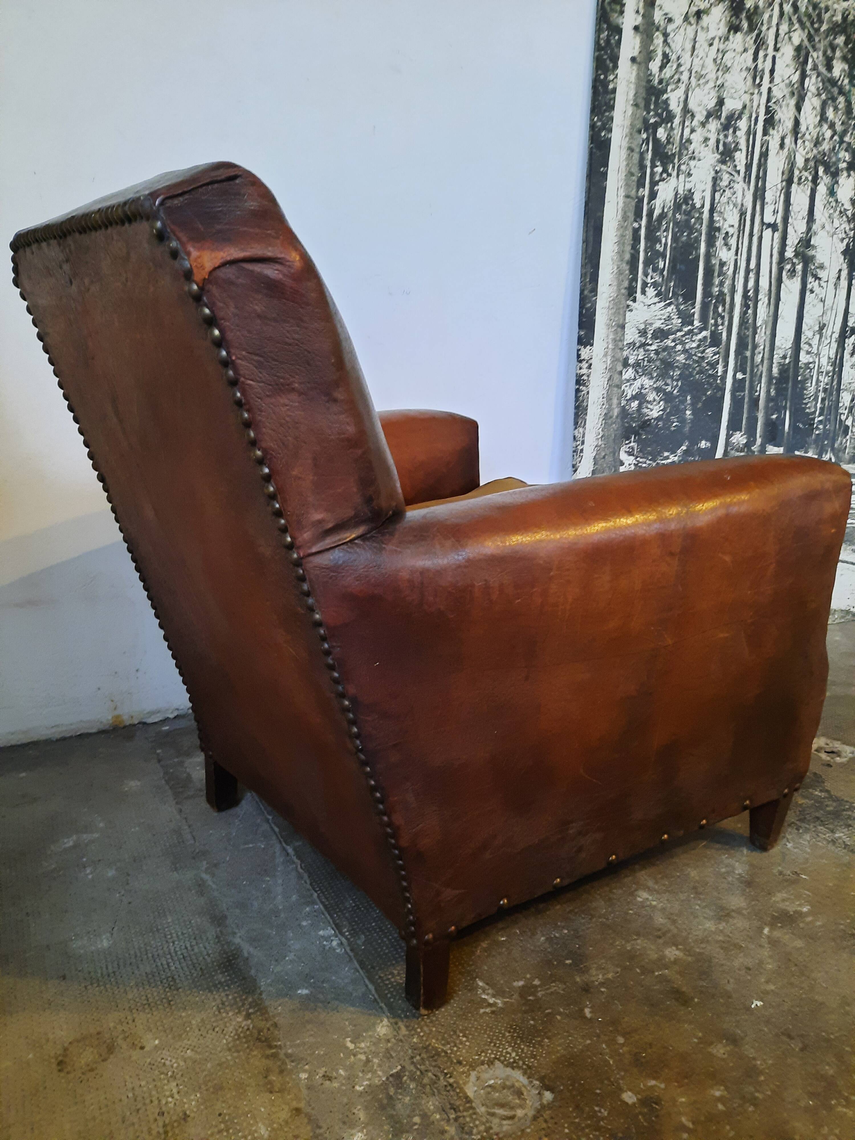 Old studded leather club chair 1930-1930
