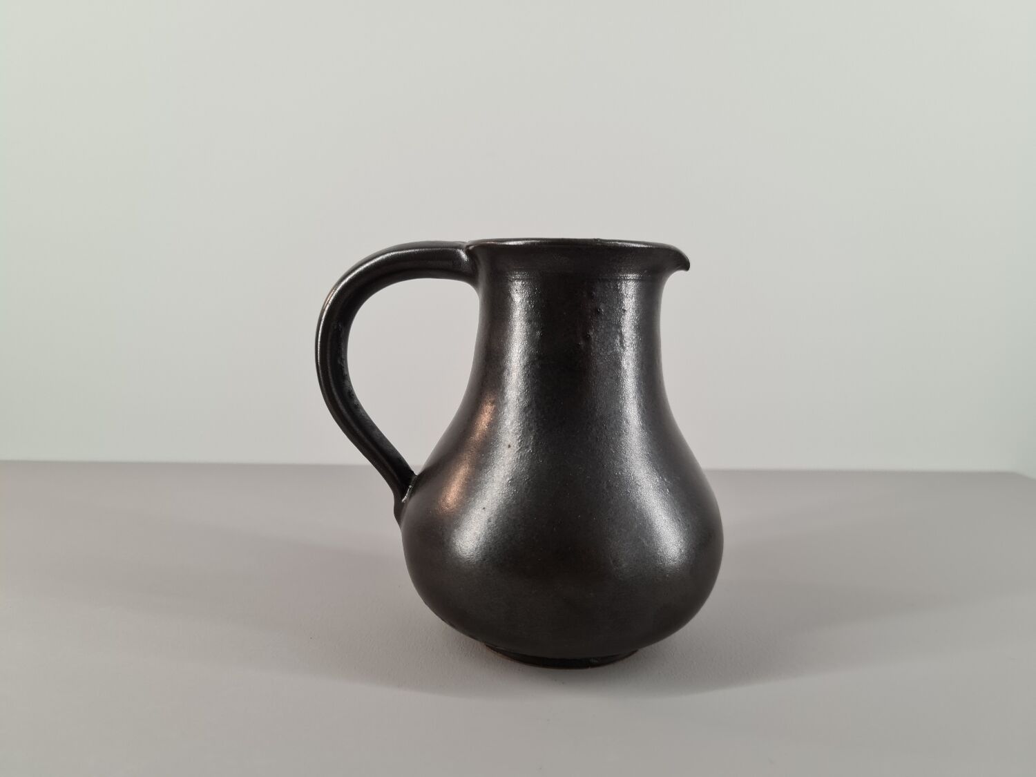 Modernist pitcher in black ceramic 50s