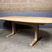 Oval extendable dining table in beech with Danish design.