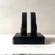 Art Deco bookends with a circular design in black and pink marble.