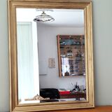 Large gold-framed mirror with bevelled glass.
