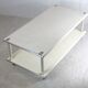 Table basse en acier laqué "crème", double plateaux, France, circa 1970