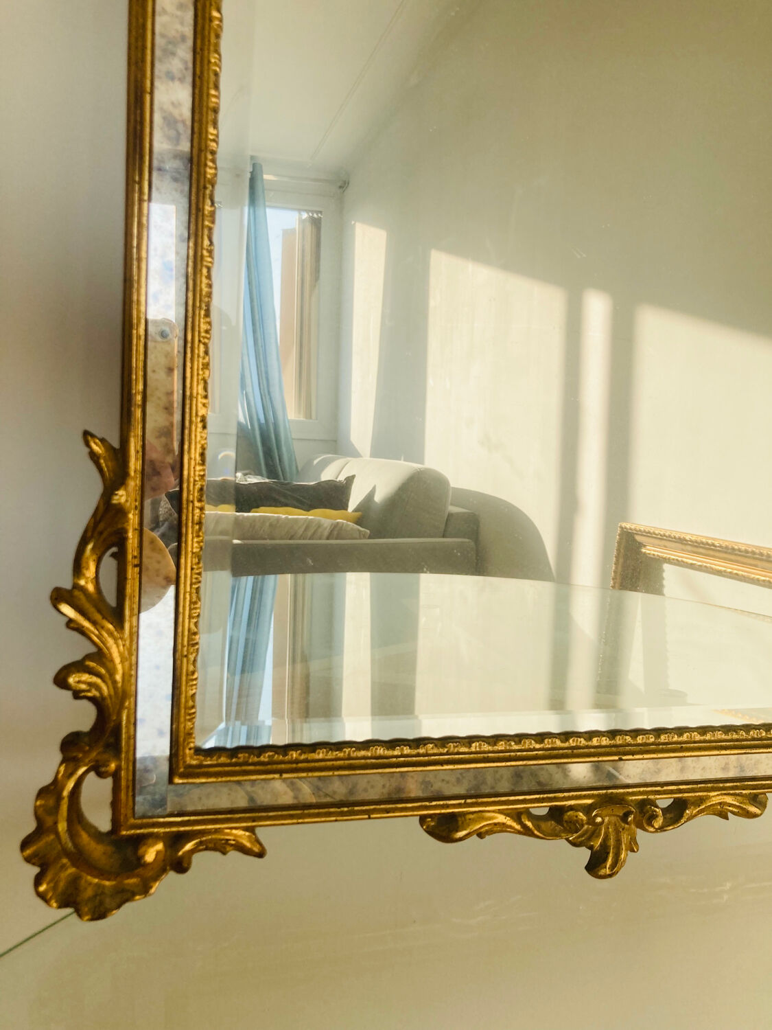 Large golden mirror parecloses