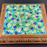 Longwy earthenware trivet on wooden mount, early 20th century