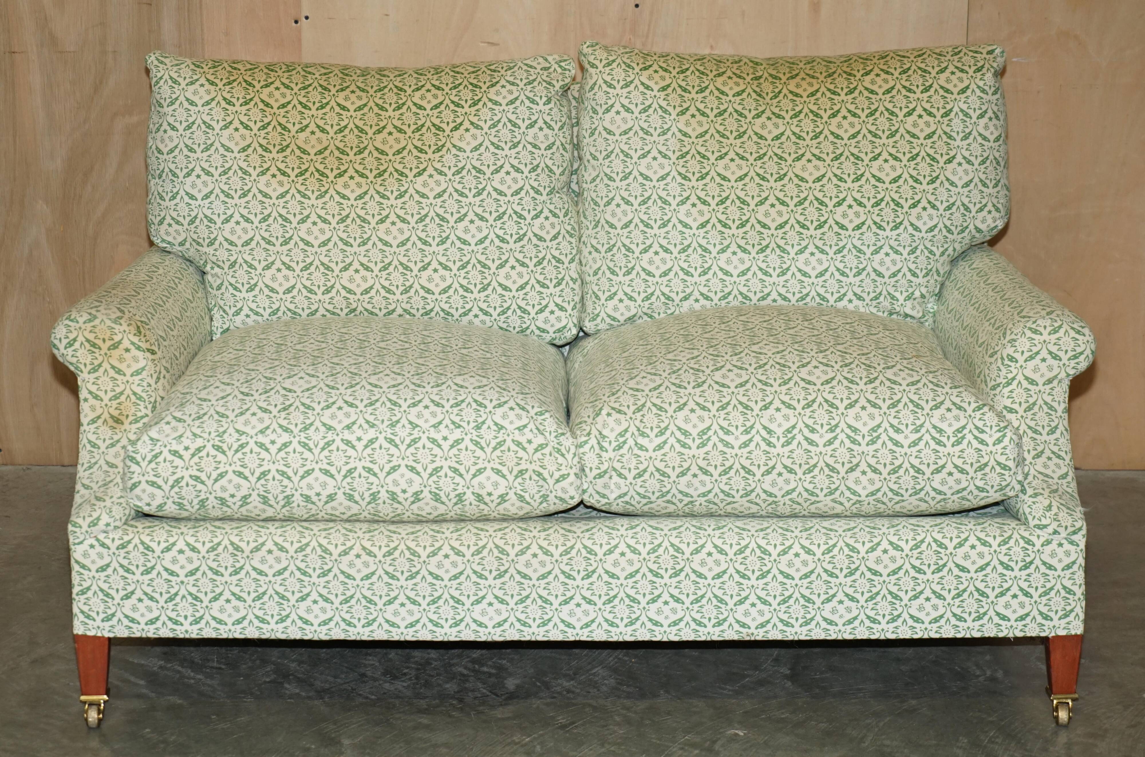 Howard & Son's Chairs Ltd ticking fabric canapé with feather cushions.