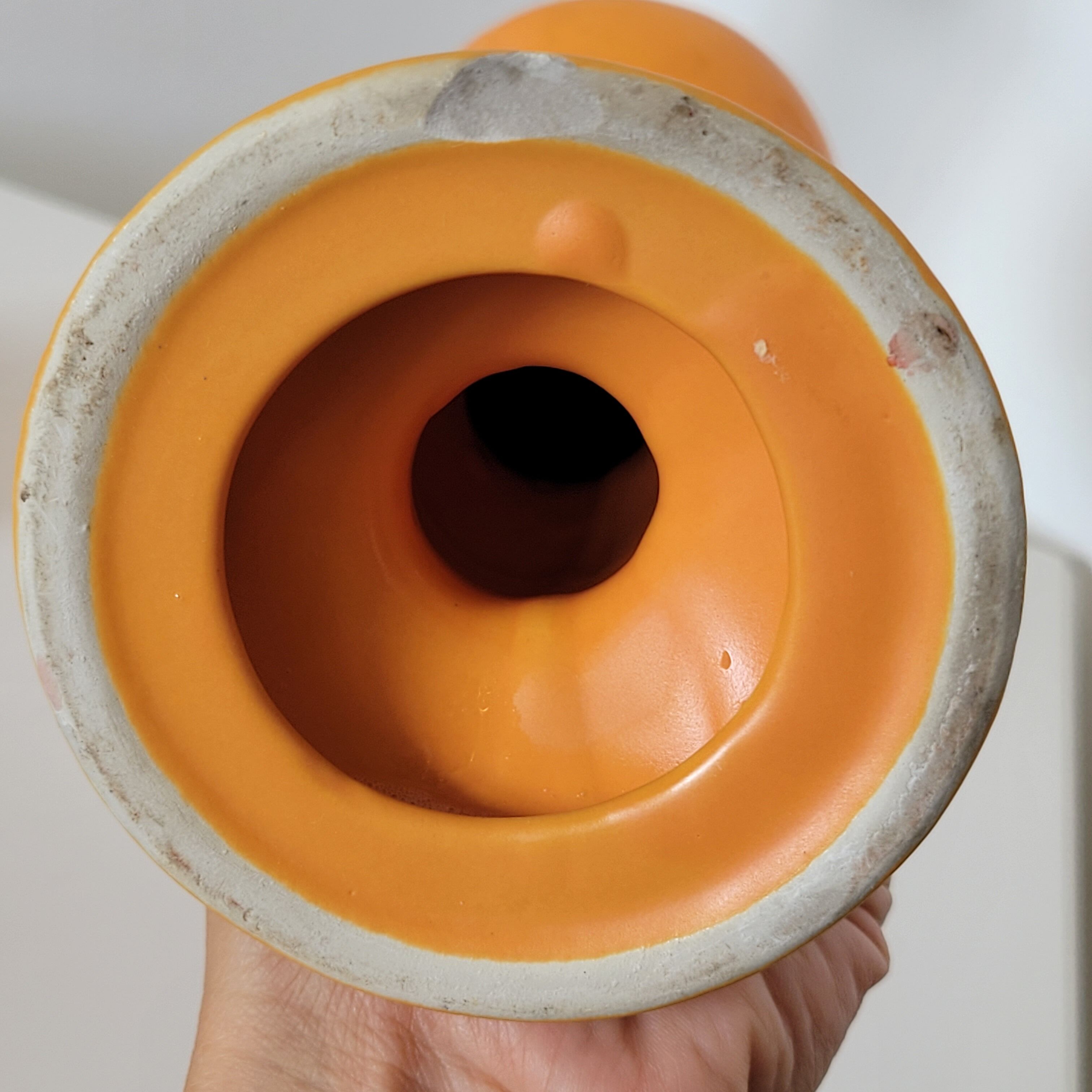 2 orange ceramic candle holders
