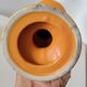 2 orange ceramic candle holders