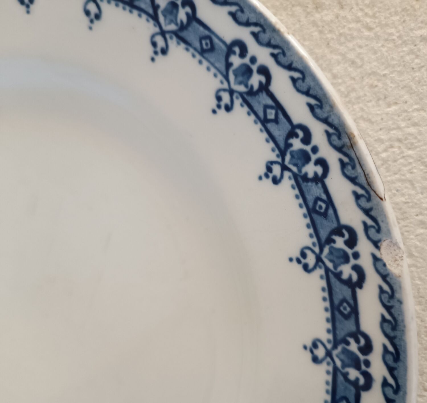 2 mismatched ironstone plates