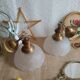Pair of frosted glass flower pendant lights with vintage wood and brass