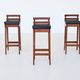 Erik Buck set of three bar stools in teak and leather Dyrlund Denmark 1960