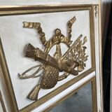 Mirror decorated with weapons