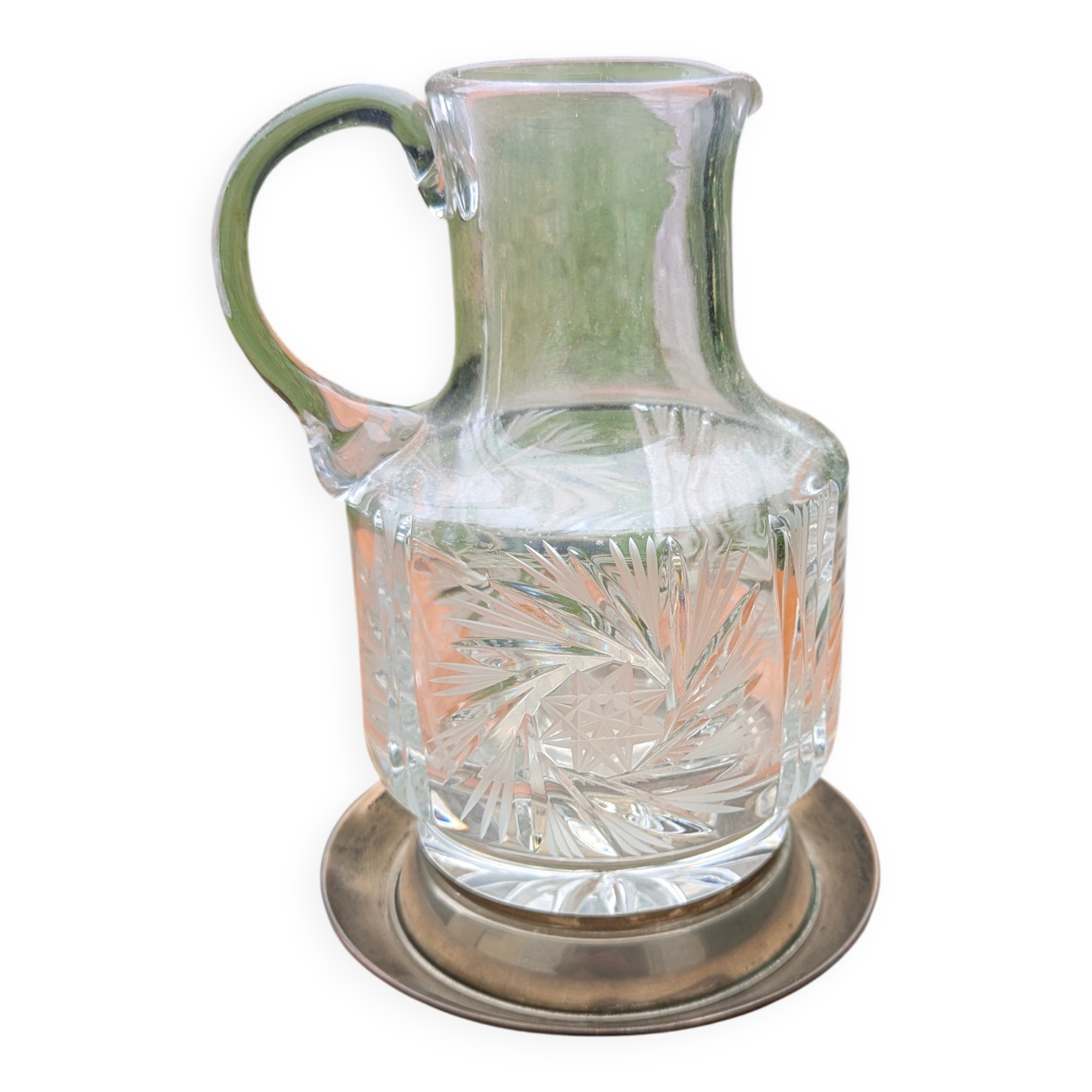 Jug / Carafe made of cut glass or crystal with its metal under-bottle.