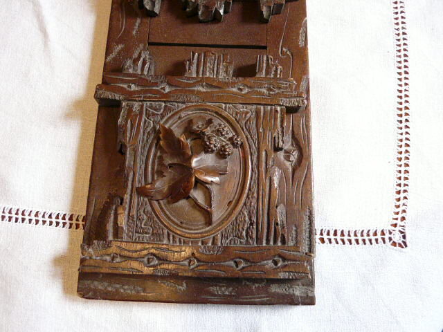 Ancien serre livre extensible forêt noire décor floral