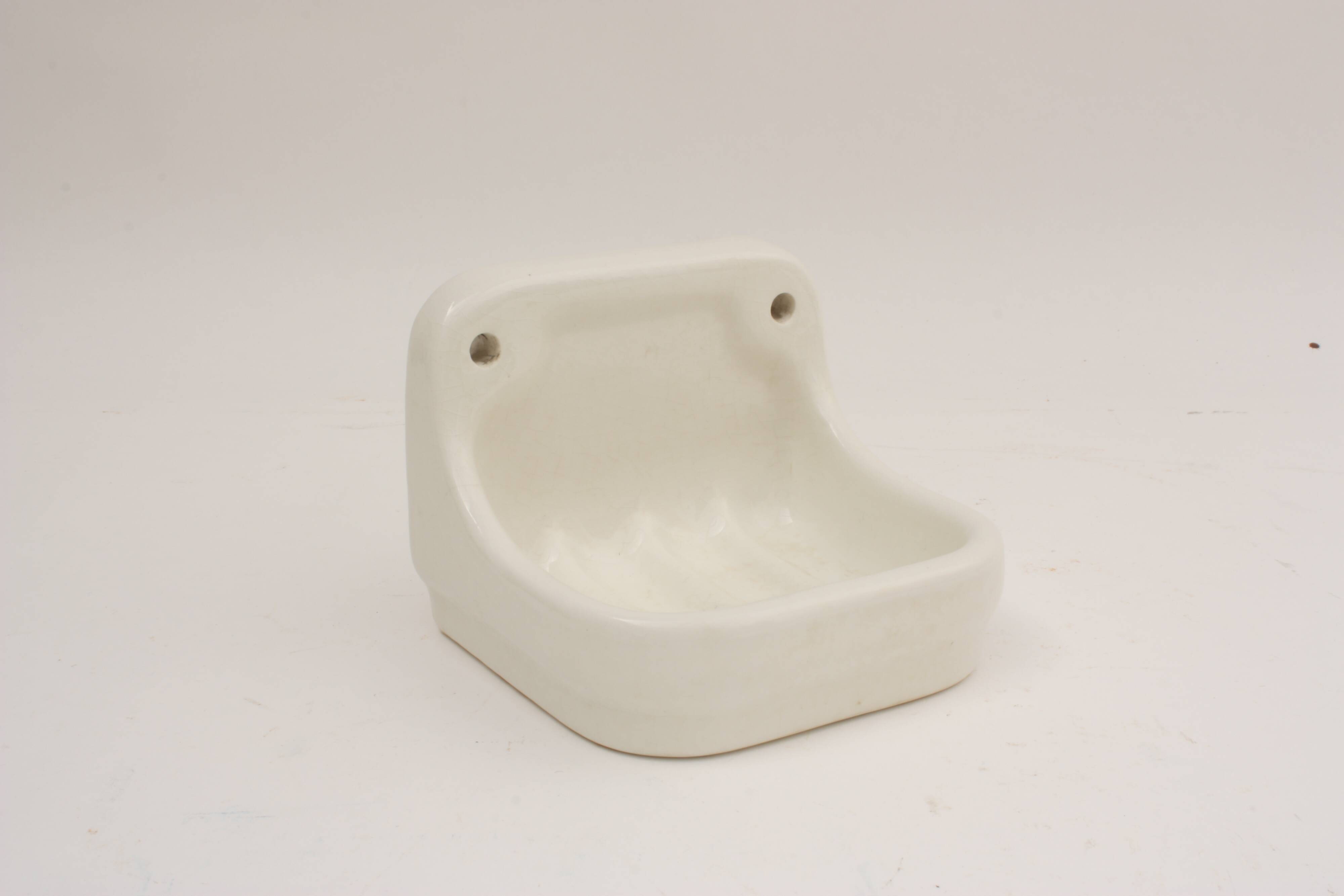 Wall-mounted earthenware soap dish
