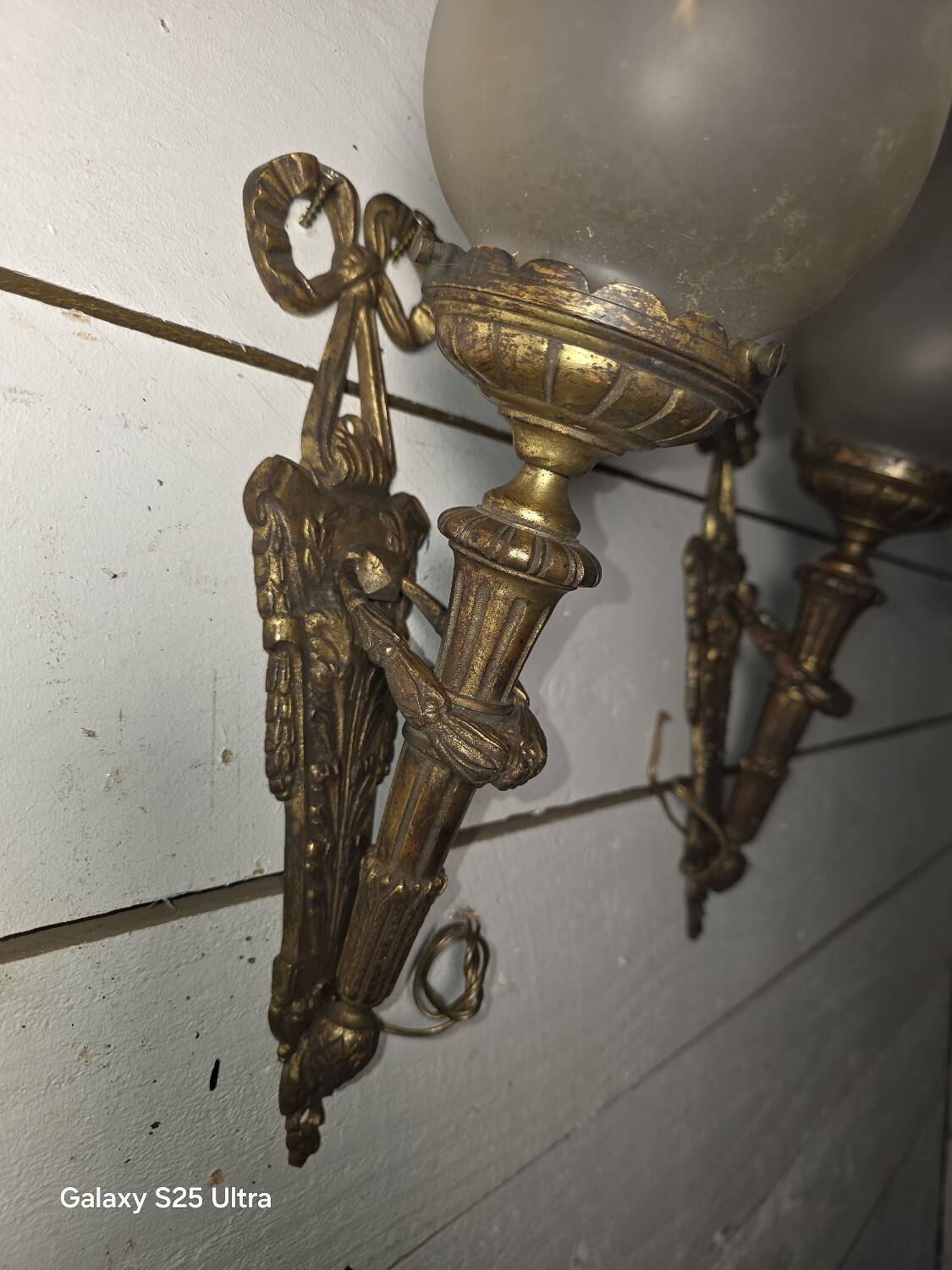 Pair of torch wall lights in Louis XVI style in 19th-century bronze.