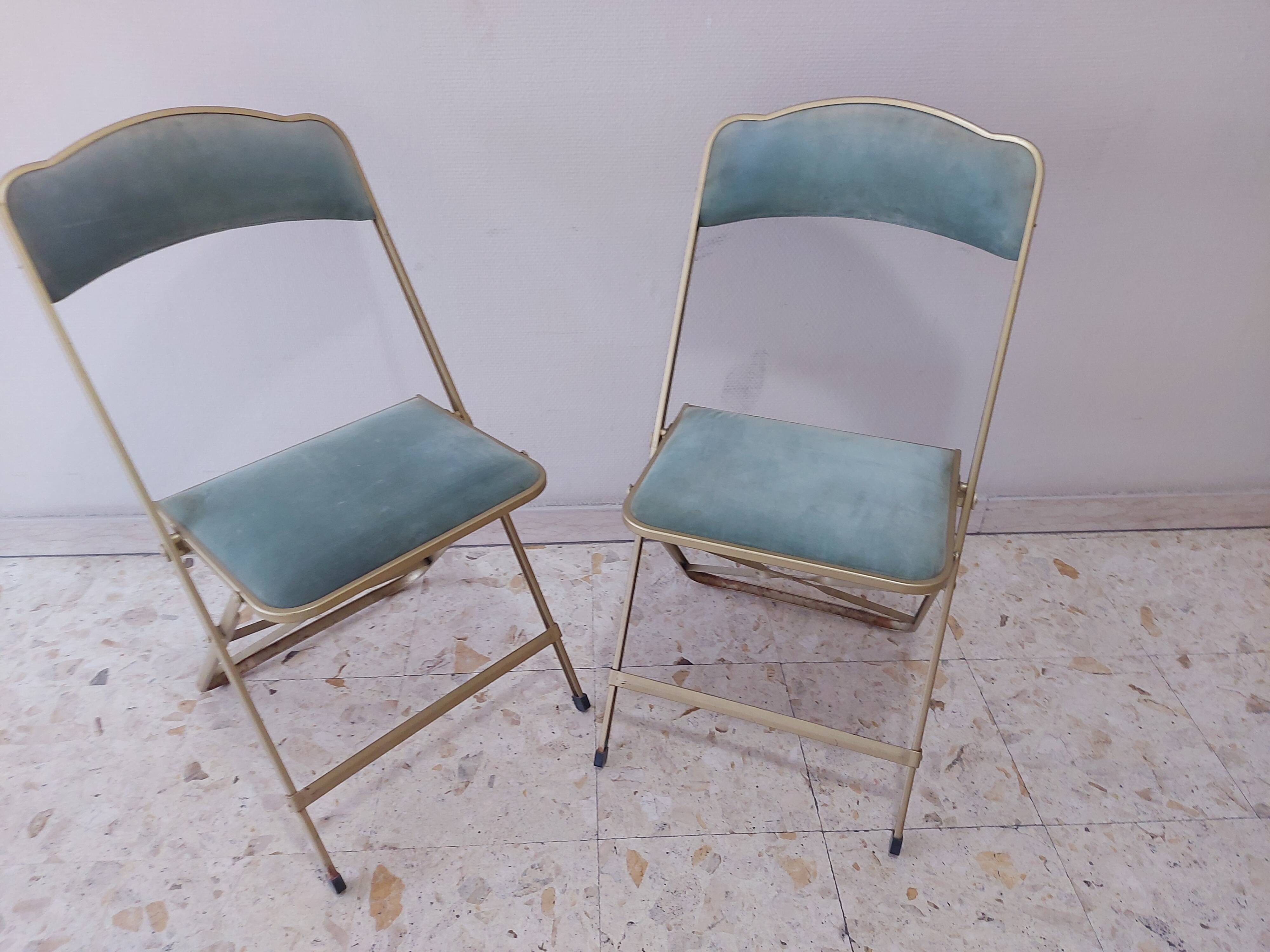 Two folding opera chairs in velvet