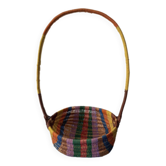Very colorful basket woven from scoubidou threads. Large cove