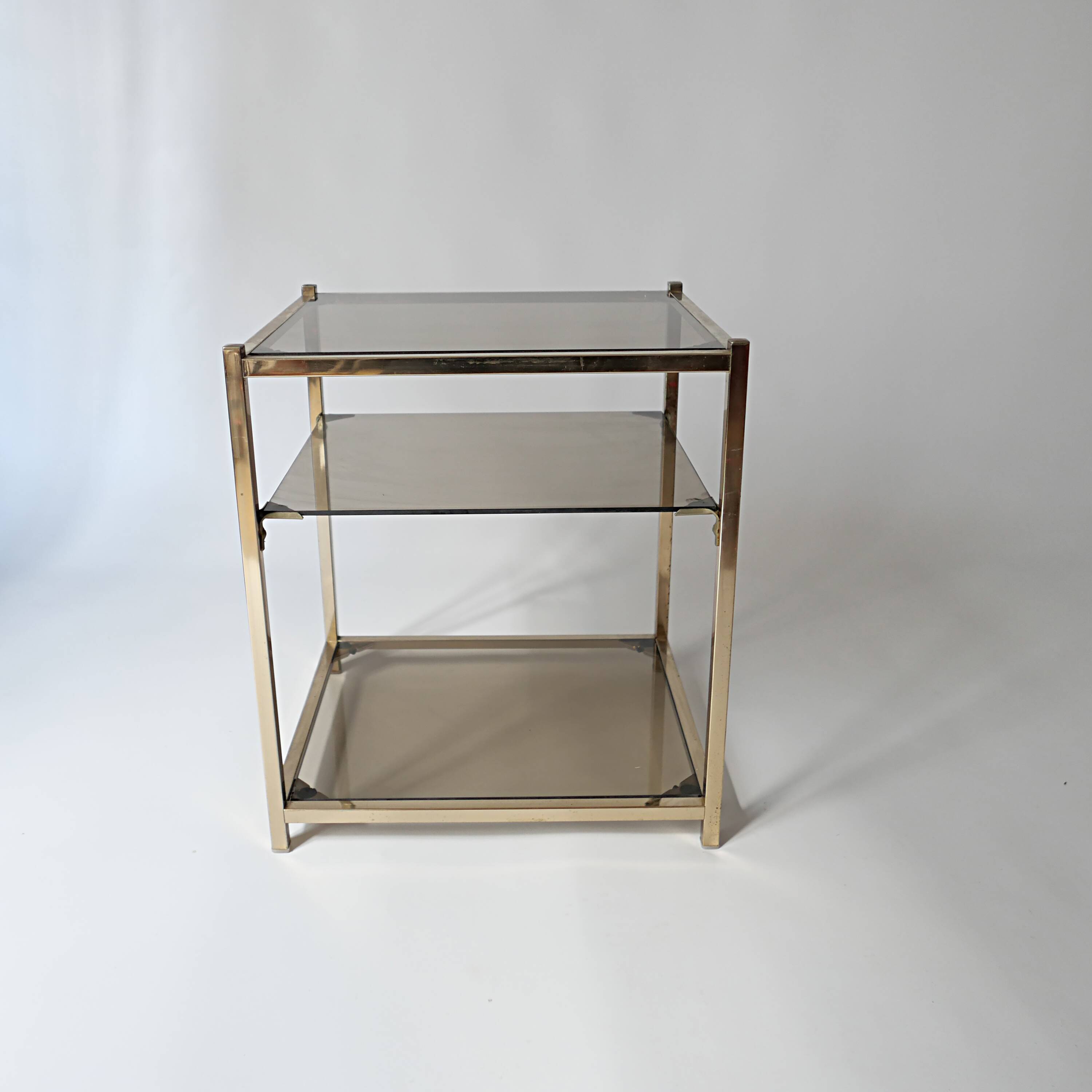 vintage coffee table design 1960s 1970s in gold metal and smoked glass