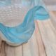 An antique lampshade in frosted glass with delicate blue edges.