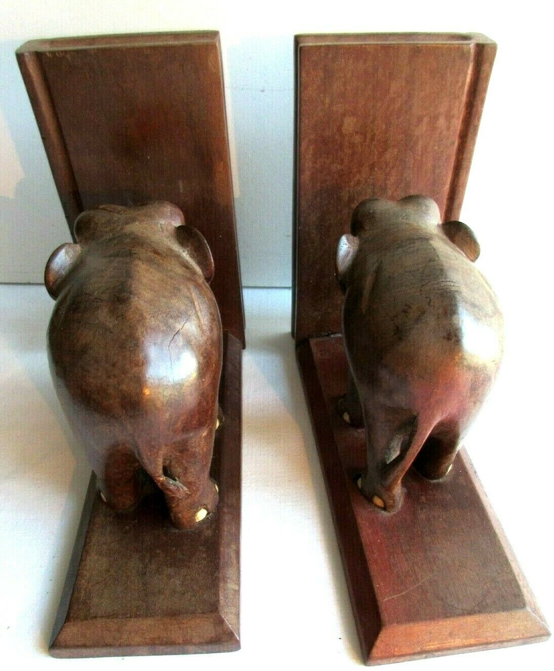 Art Deco bookends wooden elephants and bones on wooden terrace, book shape