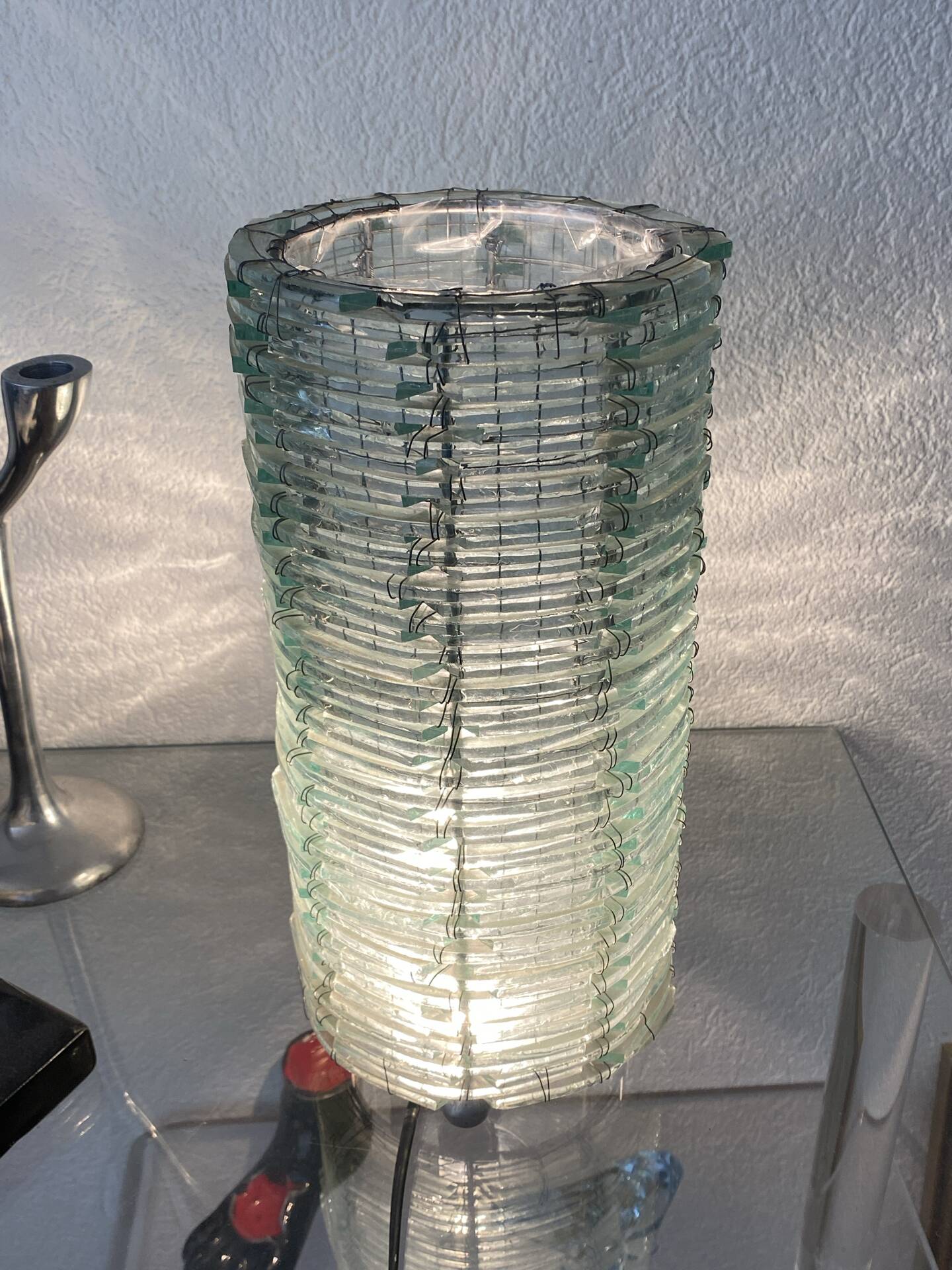 Blue-tinted glass lamp and wire.