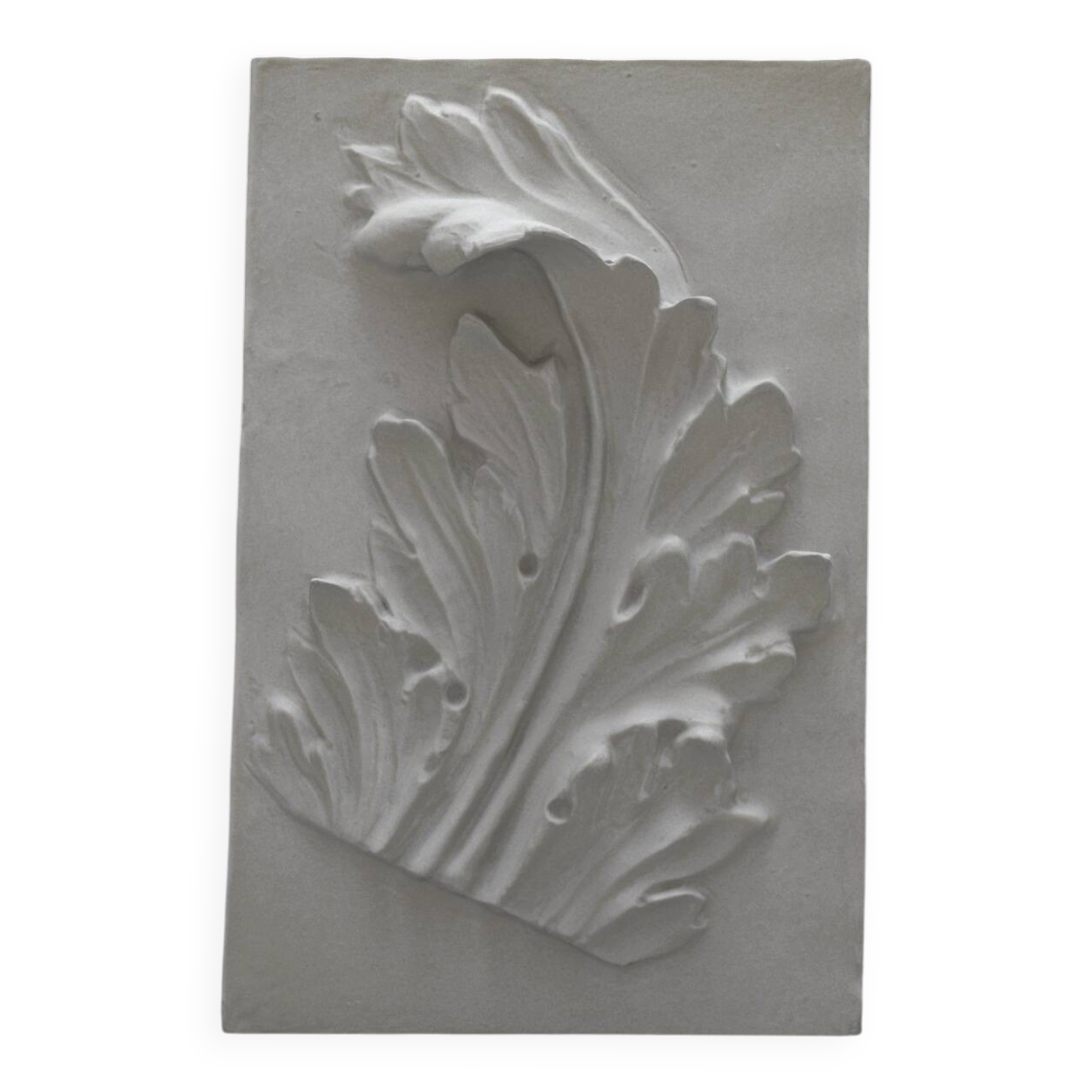 Plaster bas-relief depicting an acanthus leaf, inspired by Roman art.