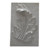 Plaster bas-relief depicting an acanthus leaf, inspired by Roman art.