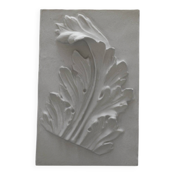 Plaster bas-relief depicting an acanthus leaf, inspired by Roman art.