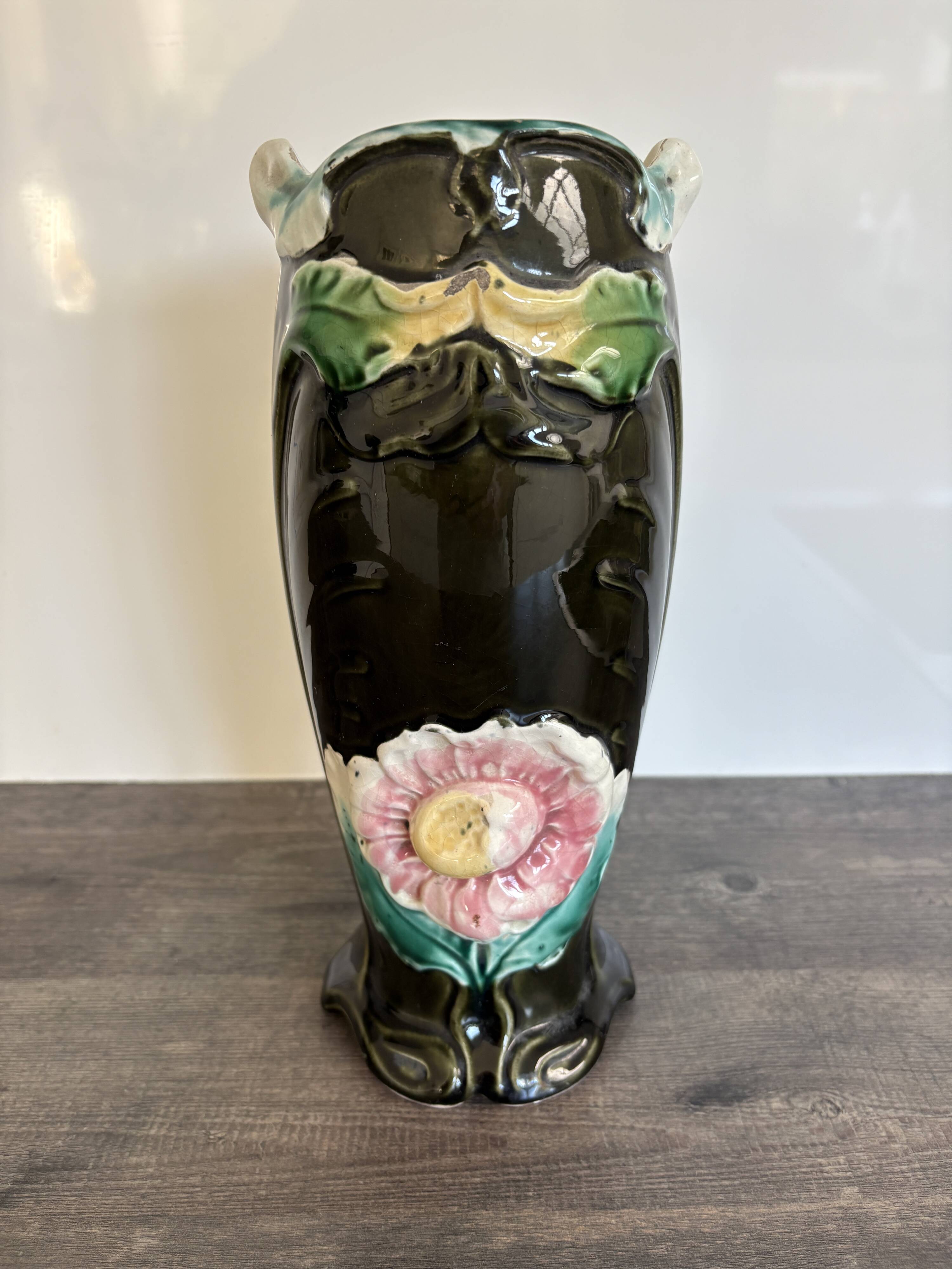 Antique ceramic vase by De Bruyn with floral decoration.