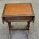 Small drop-leaf side table in English style with leather top & drawer.