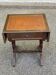 Small drop-leaf side table in English style with leather top & drawer.