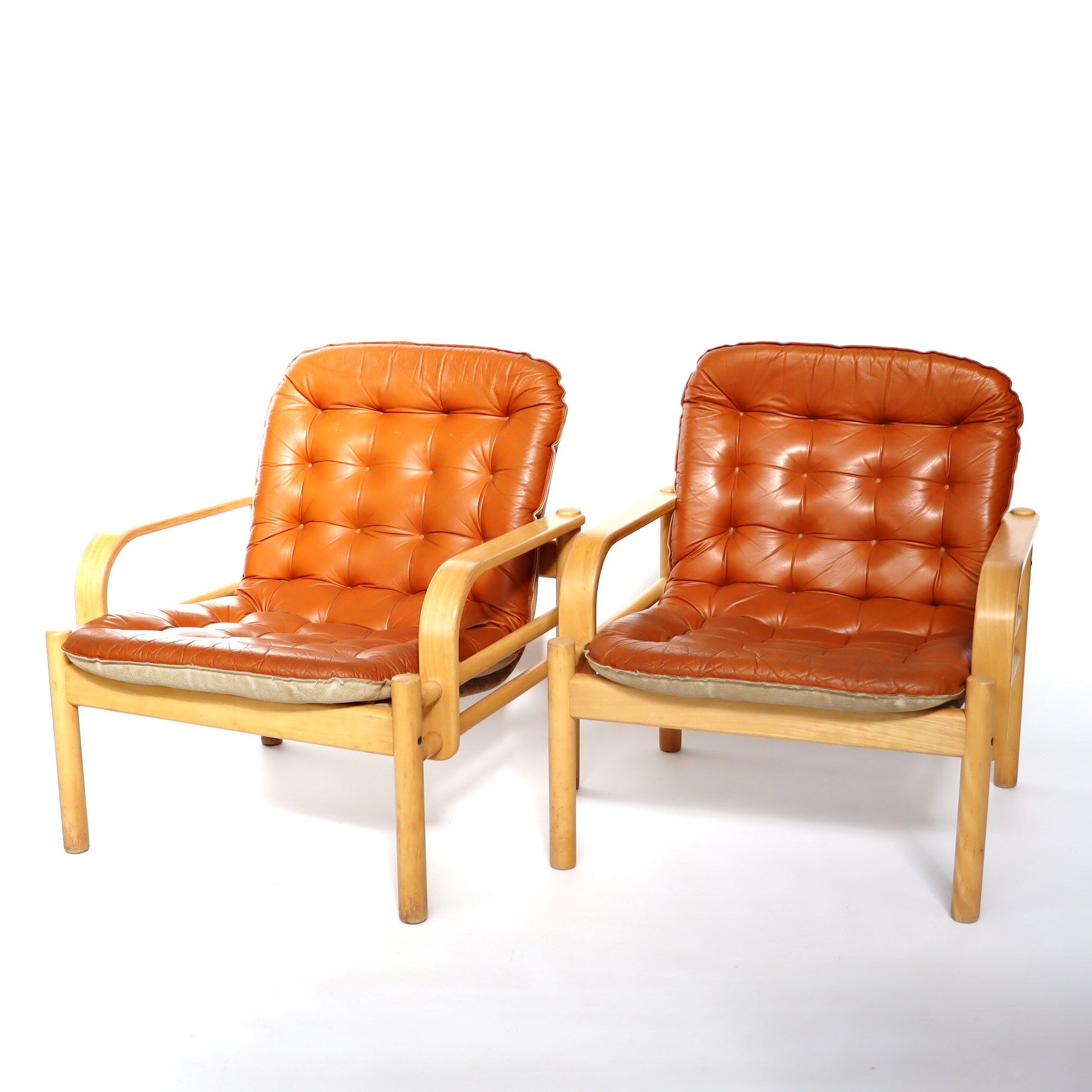 Upholstered leather armchairs 70s