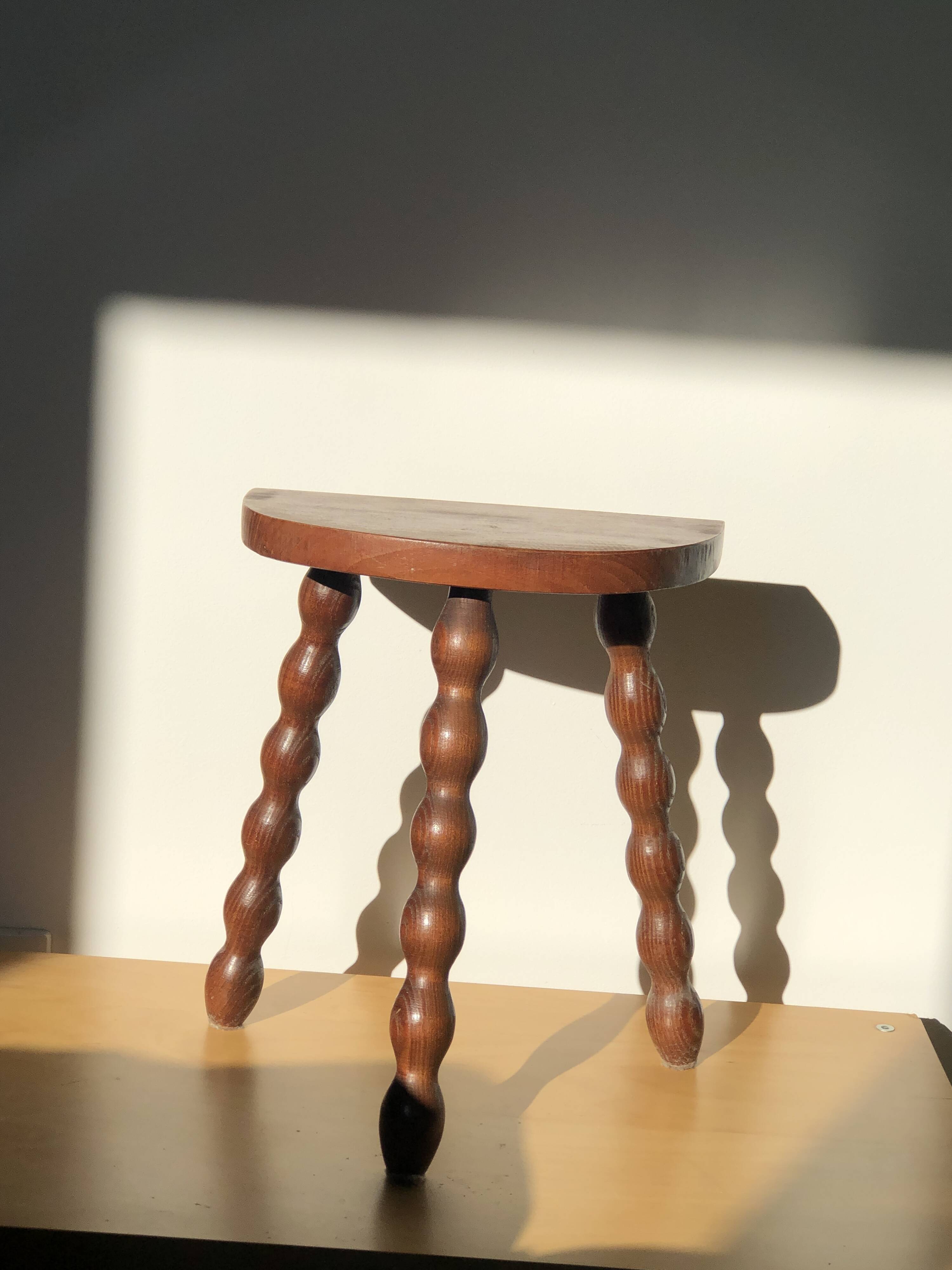 Turned wooden tripod stool