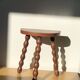 Turned wooden tripod stool