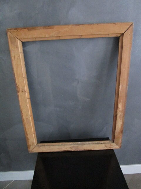 Large old frame in worked wood