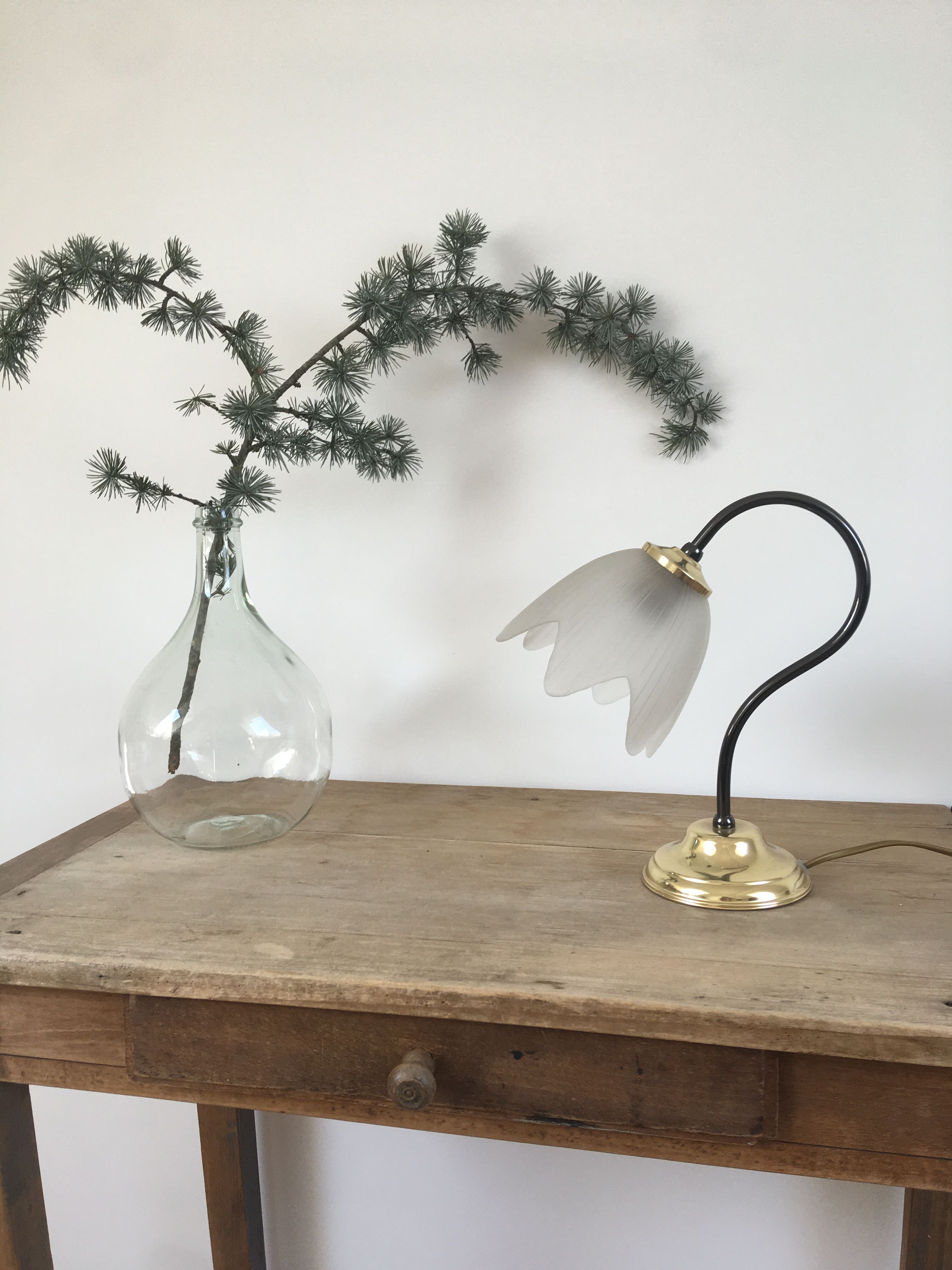 Table lamp with glass globe and brass foot
