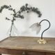 Table lamp with glass globe and brass foot