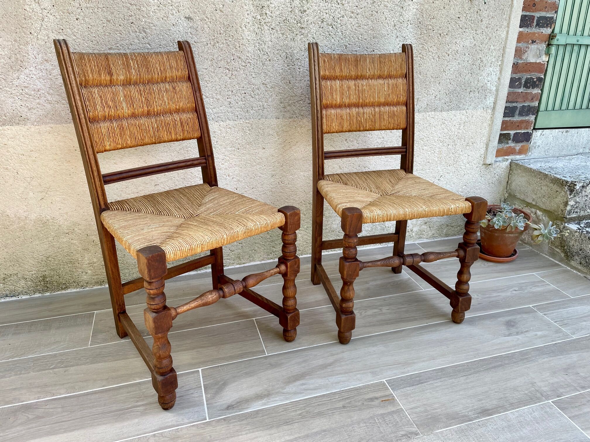 Pair of straw and solid oak chairs