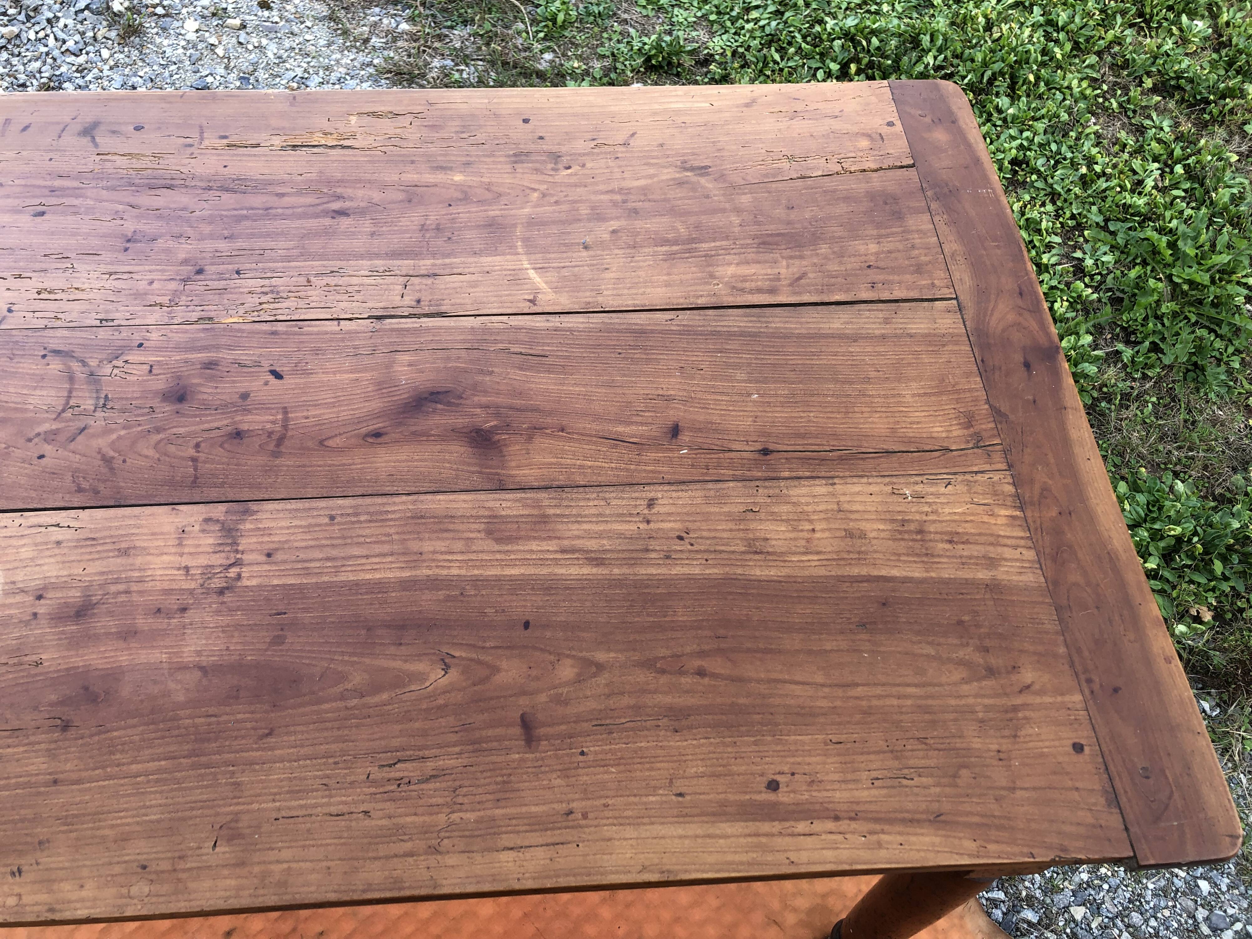 Antique cherry wood farm table with turned base with 2 drawers and 1 pull