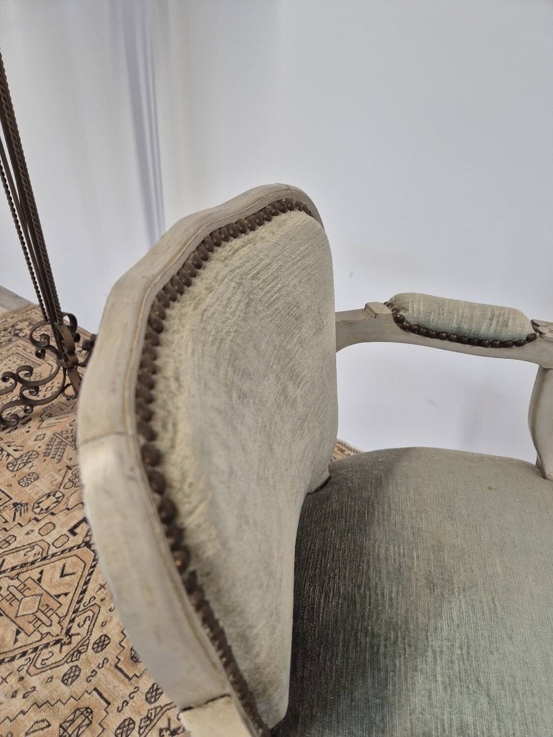 Louis XV style cabriolet armchair in patinated wood and velvet