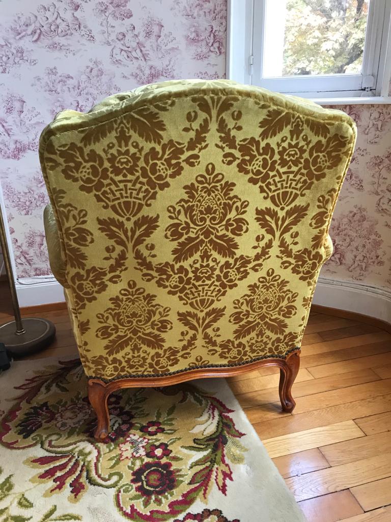 Armchair in golden yellow velvet and louis XV style cherry tree