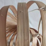 Nautilus shell-shaped chandelier made from bamboo slats