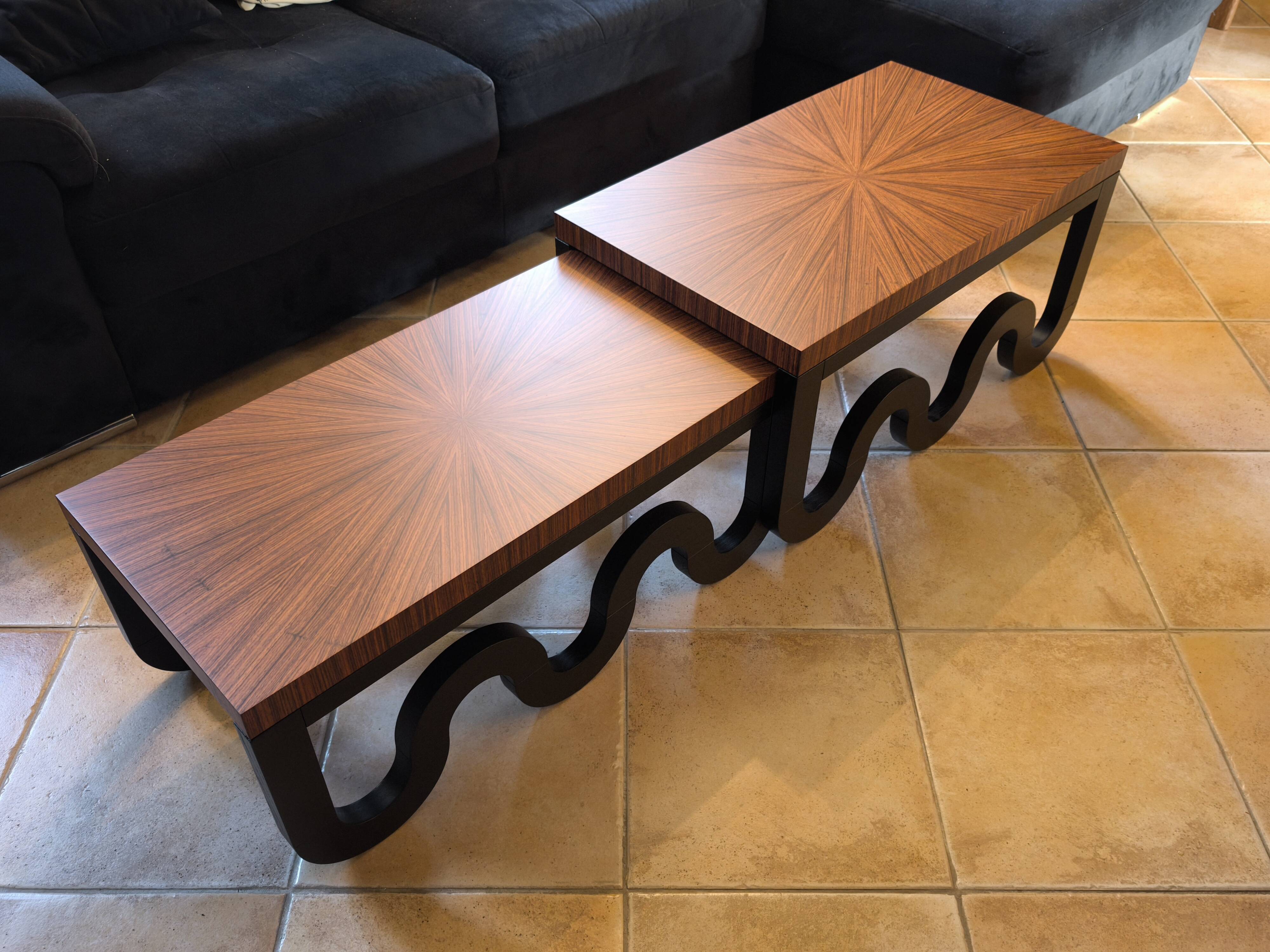 Nest of coffee tables in lacquer and rosewood veneer.