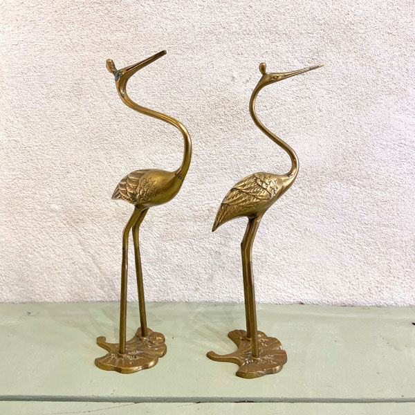 Couple of brass herons