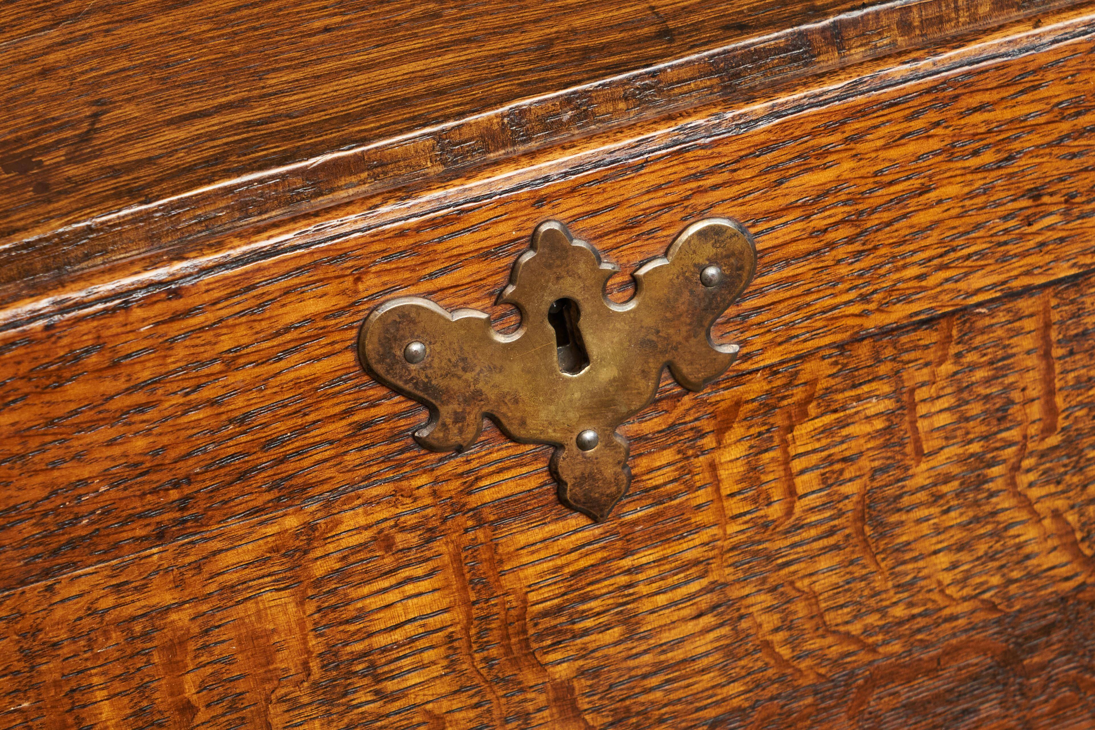 Antique English oak secretary with drop-down front.